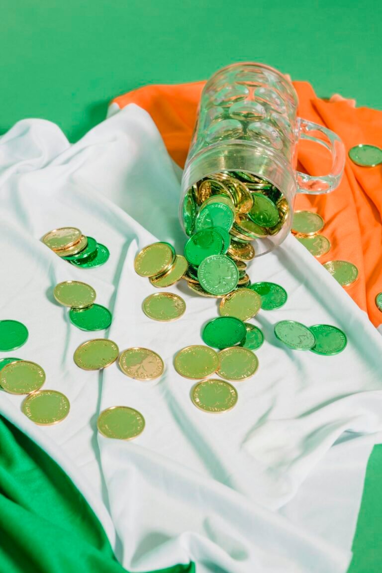 Glass with coins on Irish flag